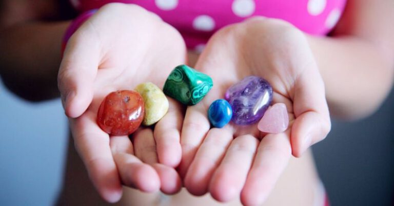 Differences - Woman Holding Six Polished Stones