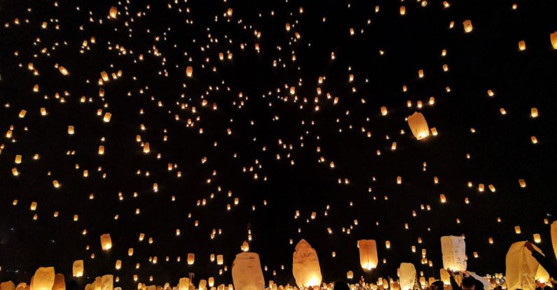 Festivals - Group of People Throwing Paper Lantern on Sky during Night