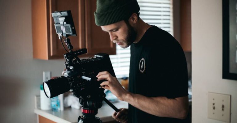 Documentaries - A Videographer Setting Up the Camera